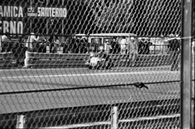 black and white image of a street in the city motorcycle