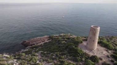 Aerial 4k footage of medieval coastal defensive tower of La Corda in Oropesa, Spain. High-quality 4k footage