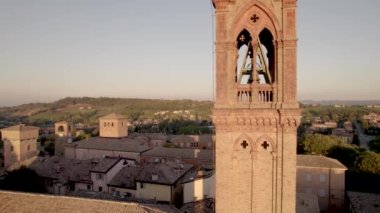  4K drone footage orbital flight of Castelvetro di Modena medieval village in Emilia Romagna during sunrise on a cold Fall afternoon. High-quality 4k footage