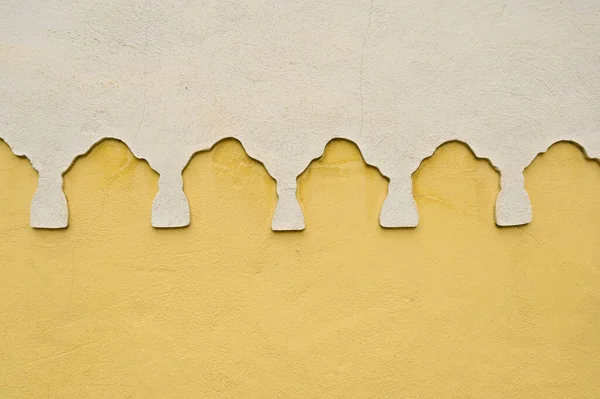 Colorful detail of an old window on an orange-painted wall. High-quality photo