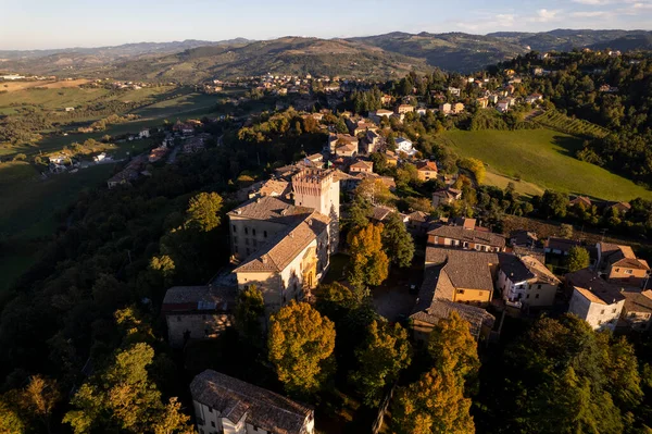 4k drone flight over the Castle of Guiglia and its forest at golden hour in Italy. High-quality photo
