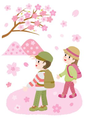 İlkbaharda kiraz çiçeği açan çocukların görüntüsü..