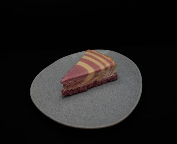 a piece of cake on a black background