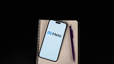 notepad with text and pen on a black background