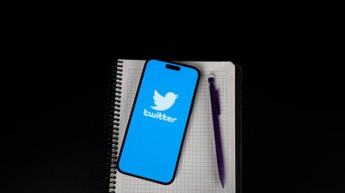 mobile phone with blank screen on a black background.