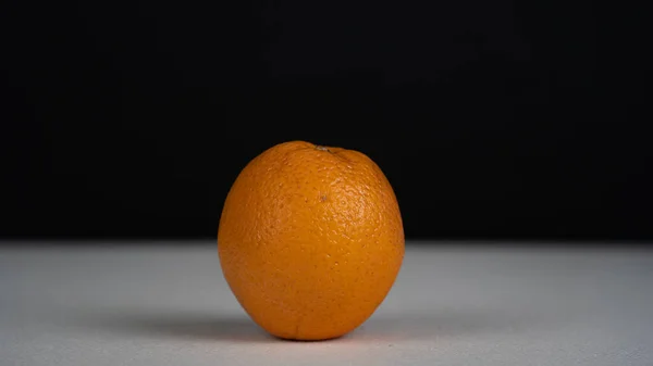 orange fruit on black background