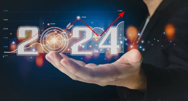 Businessman analyzes business growth plan in 2024, digital marketing strategy, revenue, profit, economy, stock market and business trends. Technical Analysis Strategies Using Future AI Technology