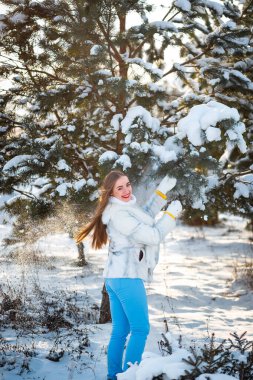 Holidays days, Christmas winter time. Woman on vacation walking outdoors. Girl in warm fashionable clothes, ladies fashion concept. Pretty nice winter style