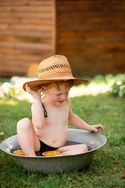 The little boy does not want to get dressed and is crying