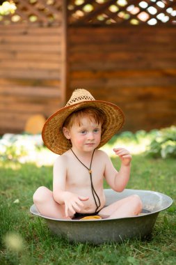 A Ukrainian boy plays at home in the summer