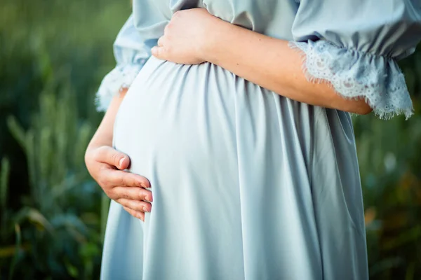 Vinnytsia, Ukraine. September 18, 2022. The expectant mother hugs her tummy where the baby lives