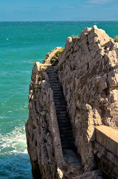 View of some stairs on a rock in the port of Castro Urdiales