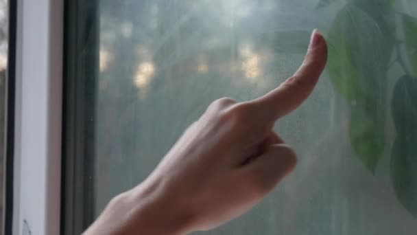 Girl Runs Her Finger Window Glass Home Glass Very Dirty — Stock Video