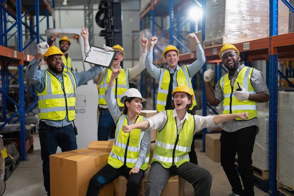 Diversity group of labor union in warehouse celebrate success after won protest salary increment