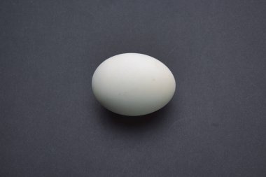 A top view photo of eggs on a black background. salted duck egg.