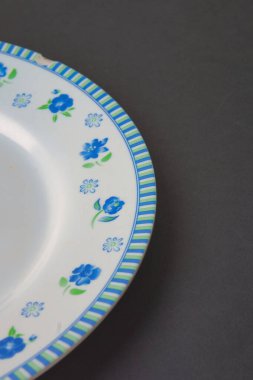 classic white plate with black background.