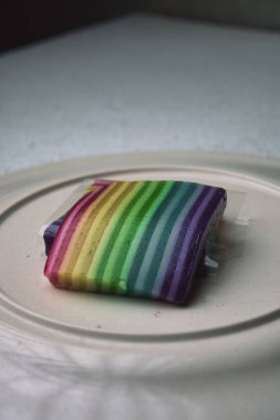 colorful layered cakes on a plate.