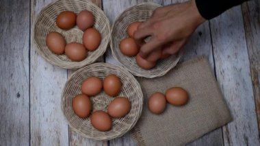 Don't put all your eggs in one basket concept. eggs in a rattan basket