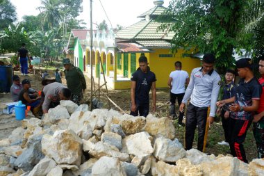 Padang Jaya Village residents are working together to build a retaining wall