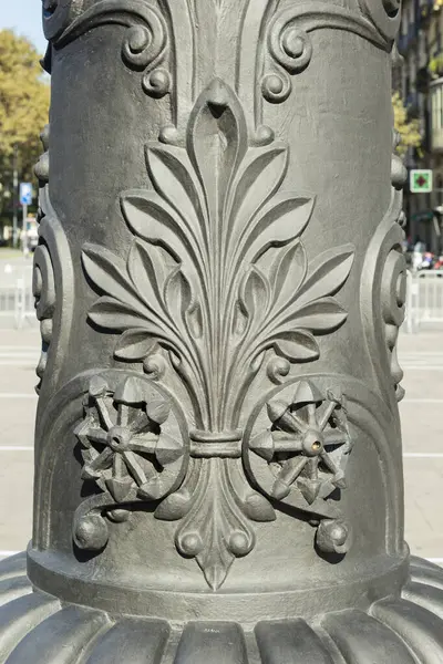 Stock image Detail of decoration carved on iron street lamps in Barcelona city, Spain. This ornament represents the classic acanthus plant, which was usually used by ancient greek culture, classic Rome and neoclassic times in Europe.