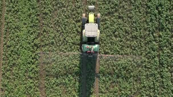 Top View Tractor Spraying Field — Stock Video