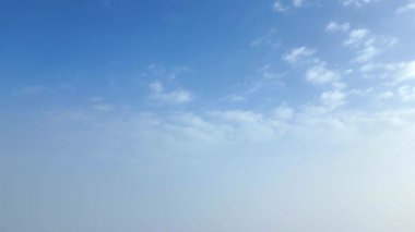 Blue sky gradually turns into white mist as clouds cover the view