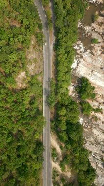 Aerial view of car driving on mountain road