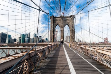 Brooklyn Bridge, view from the pedestrian walkway. The bridge's cable arrangement forms a distinctive weblike pattern.