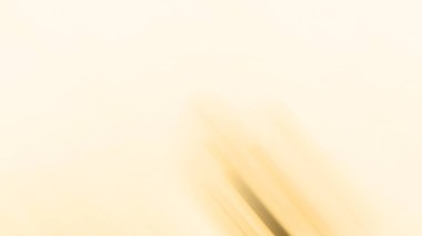 abstract pastel soft colorful smooth blurred textured background off focus toned in gold color