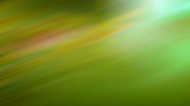 Kırmızı ve sarı çizgili bulanık yeşil bir arkaplan