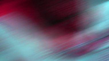 Cep telefonu tutan kişinin bulanık bir fotoğrafı.