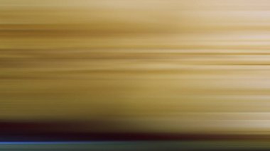 Sarı bir duvarın bulanık fotoğrafı.