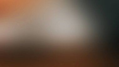 Cep telefonu tutan kişinin bulanık bir fotoğrafı.