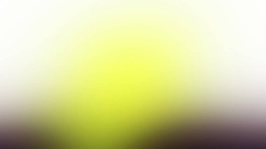 Tek çiçekli bulanık sarı ve yeşil bir arkaplan.