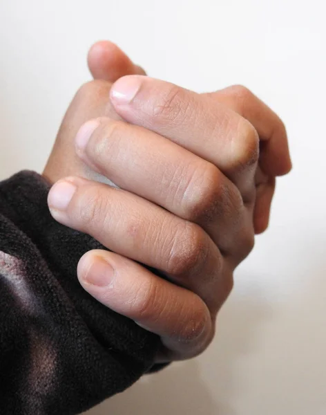 close-up of male hands with blue manicure