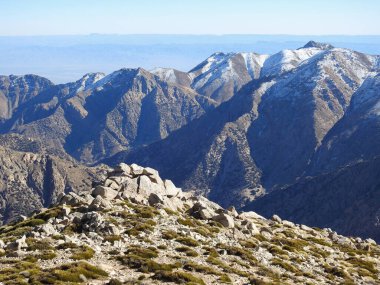 mountain rises above the surrounding landscape and is characterized by peak or ridge. And Snow is a type of precipitation during winter. can accumulate on the ground, is also an important source of freshwater for many ecosystems around the world. 
