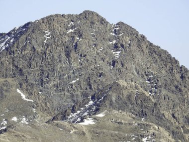 mountain rises above the surrounding landscape and is characterized by peak or ridge. And Snow is a type of precipitation during winter. can accumulate on the ground, is also an important source of freshwater for many ecosystems around the world. 
