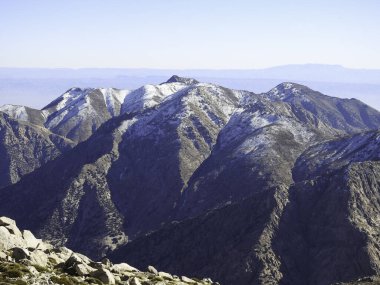 mountain rises above the surrounding landscape and is characterized by peak or ridge. And Snow is a type of precipitation during winter. can accumulate on the ground, is also an important source of freshwater for many ecosystems around the world. 