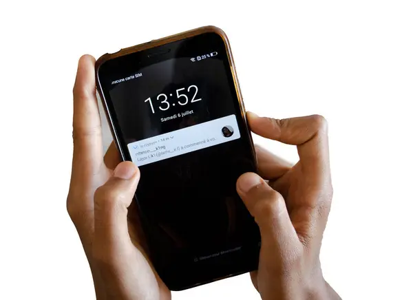 stock image Smartphone in hand, tapping the screen, Fingers scrolling on a digital display, Hand holding and navigating a mobile device.