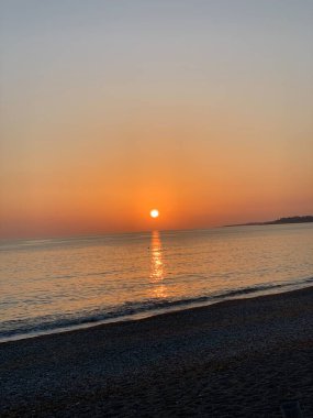 a breathtaking sunset of the sea and the waves