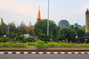 Semarang, December 2022. Portrait of a central park in the middle of Semarang city with the hustle and bustle of vehicles in the afternoon.