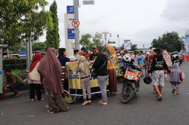 Semarang, December 2022. The atmosphere of the Tegal city square in the afternoon with many tourists visiting.