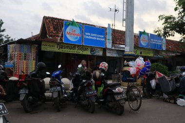 Semarang, December 2022. Photo of the motorbike parking lot in the Tegal city square which is crowded and full of motorcycle visitors.