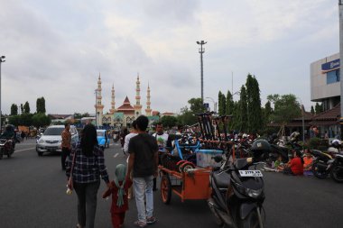 Semarang, December 2022. The atmosphere of the Tegal city square in the afternoon with many tourists visiting.