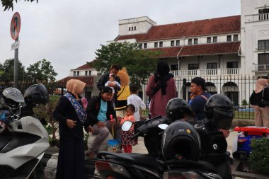Semarang, December 2022. The atmosphere of the Tegal city square in the afternoon with many tourists visiting.
