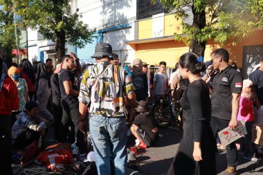 Kudus, December 2022. People on Car Free Day, exercise and relax with family, girlfriends, friends in the town square of Kudus, Indonesia.