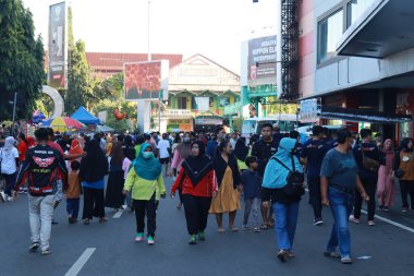 Kudus, December 2022. People on Car Free Day, exercise and relax with family, girlfriends, friends in the town square of Kudus, Indonesia.