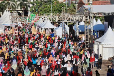 Kudus, December 2022. People on Car Free Day, exercise and relax with family, girlfriends, friends in the town square of Kudus, Indonesia.