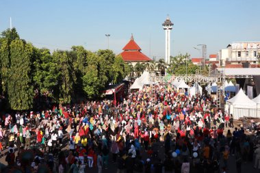 Kudus, December 2022. People on Car Free Day, exercise and relax with family, girlfriends, friends in the town square of Kudus, Indonesia.