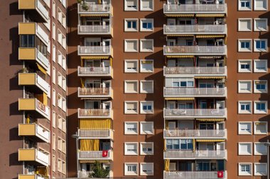 modern architecture, urban background - house facade with windows and balconies.